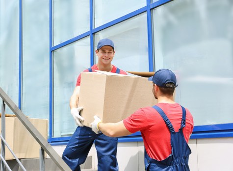 Local moving team unloading items into a Hampstead home