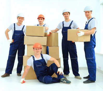 Packed household items and moving van prepared for a Hampstead move