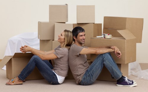 Home removals team loading household items for transport