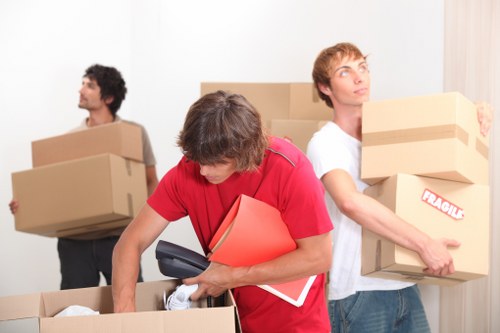 Local removal truck loading boxes and furniture in Hampstead