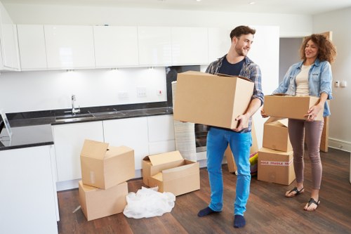 Removal professionals handling furniture with care during transit