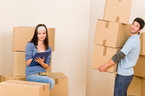 Careful flat removals setup with boxes and furniture in Hampstead